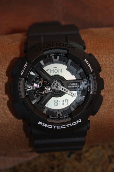 1986 Ford Bronco - Close-up of a black Casio G-Shock watch showing the time and day.