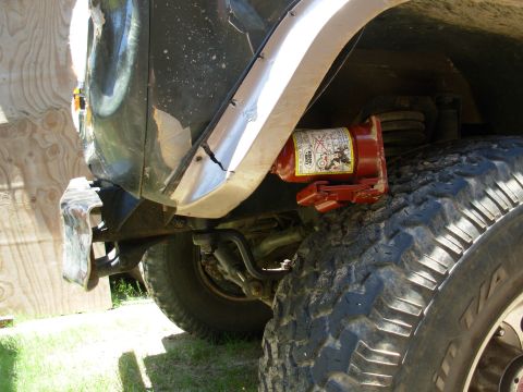 1975 Ford Bronco - Just to make the truck driveable while waiting for parts to come in, I'm pushing the body back out so the tire can clear when steering.