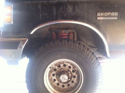 1990 Ford Bronco - This 1990 Ford Bronco has a lifted suspension system visible from the side.