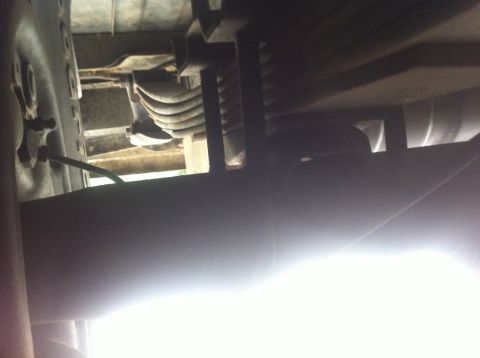 1990 Ford Bronco - Undercarriage components, including leaf springs, are visible in this close-up shot.