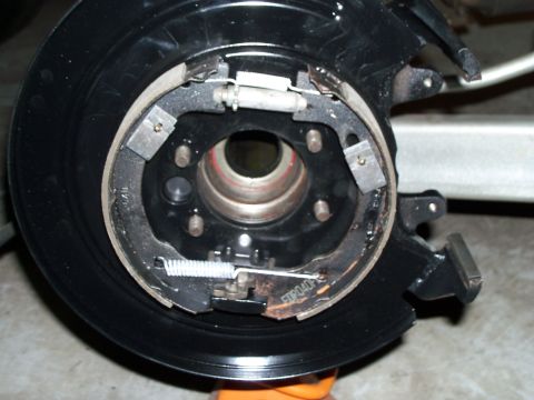 1979 Ford Ranchero - 2000 Crown Vic rear disc brake backing plate installed with new parking brake shoes and hardware. Freshly painted.