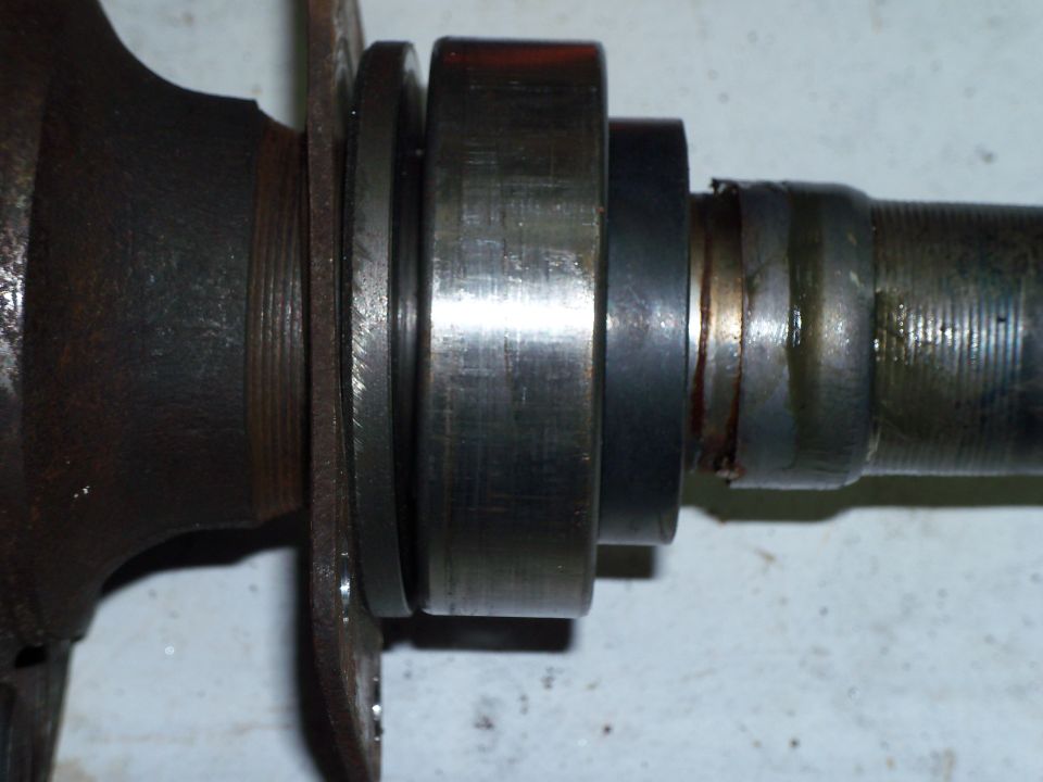 31 spline axle from '72 Lincoln Mark IV small bearing housing installed in my '79 Ranchero. This pic shows the retainer, wheel bearing spacer (needed for Crown Vic rear disc brake conversion), wheel bearing, lock ring and wear sleeve (National part #JV1277).