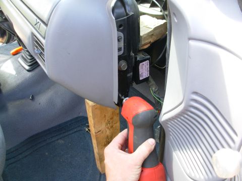 1983 Ford Bronco - After loosening the 4th bolt on the column support, wedging the dash a little farther out, and swapping to a 3/16" bit, access was muc…