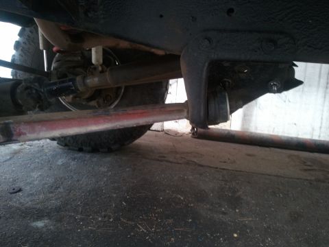 1978 Ford Bronco - Close-up view of the undercarriage, focusing on suspension and drive components.