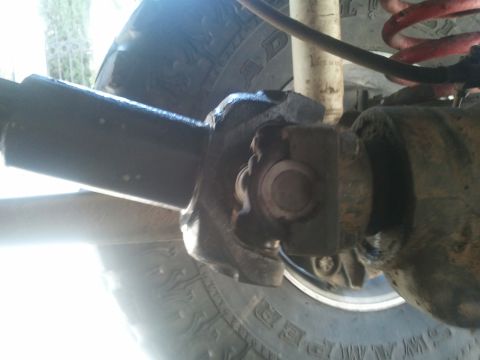 1978 Ford Bronco - Close-up of a driveshaft universal joint, part of a vehicle's drivetrain.