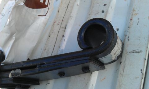 1996 Ford Bronco - A close-up view of a vehicle's leaf spring, showing a label with some text.