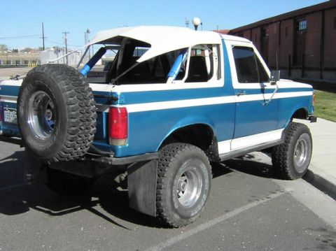 1996 Ford Bronco - This 1996 Ford Bronco features a lifted suspension and a spare tire mounted on the rear.
