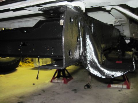 1979 Ford Bronco - Vehicle frame and suspension components are visible, supported by jack stands.