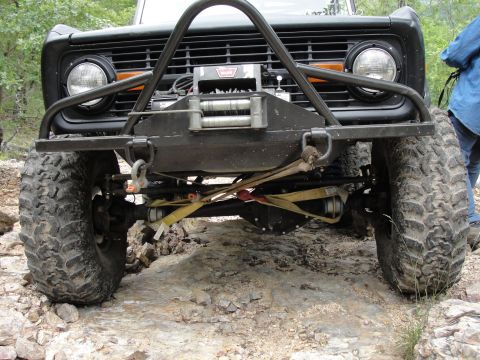 1967 Ford Mustang - This heavily modified off-road vehicle features a prominent winch and aggressive tires, suggesting it's built for challenging terrain.