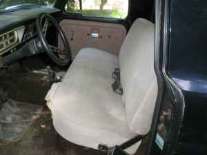 1995 Ford Bronco - Interior view of an older model pickup truck, focusing on the driver's seat and dashboard area.