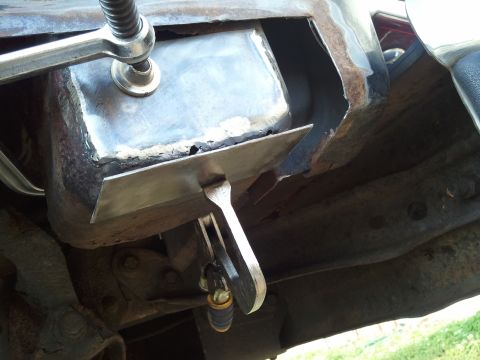 1989 Ford Bronco - Clamps secure a metal patch during underbody repair work.