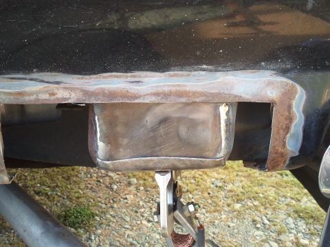 1989 Ford Bronco - Metal fabrication is underway on the vehicle's chassis, with welding equipment attached.