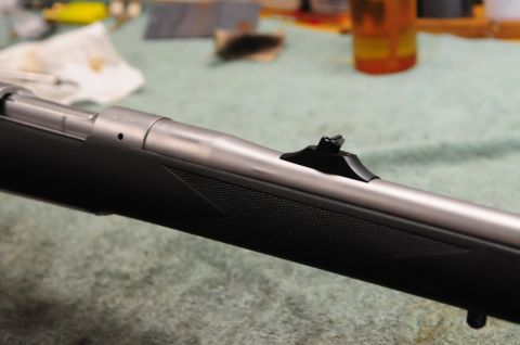 1991 Ford Bronco - Close-up view of a rifle's receiver and barrel, showing the rear sight assembly.
