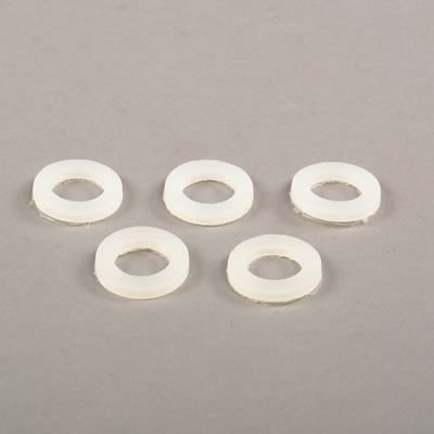 1990 Ford Bronco - A group of five white rubber washers are displayed on a neutral gray surface.