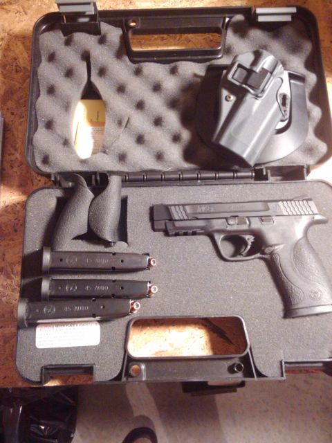 1989 Ford Bronco - A Smith & Wesson M&P pistol is displayed with three magazines and a holster inside its fitted carrying case.