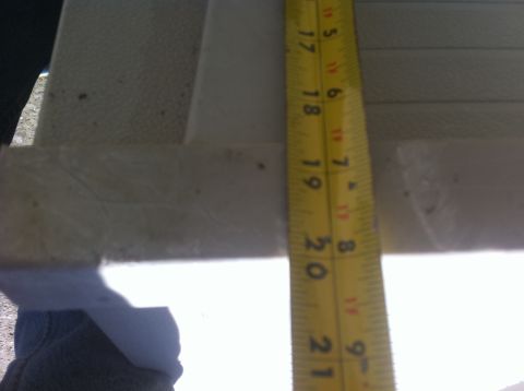1990 Ford Bronco - A measuring tape is used to gauge the dimensions of an interior panel.