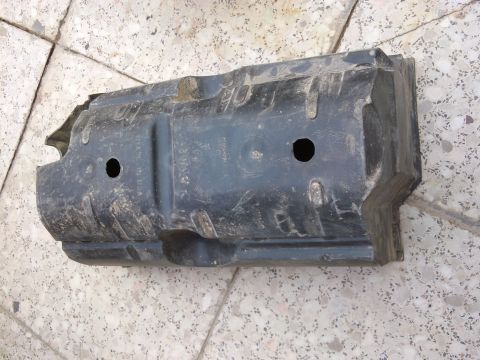 1998 Ford Crown Victoria - This is a part of a vehicle, likely an engine splash shield, shown from an underside perspective.