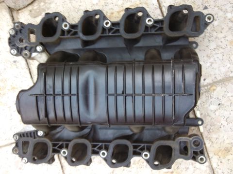 1998 Ford Crown Victoria - This is a black plastic intake manifold, likely for a Ford vehicle, but not a 1998 Crown Victoria.