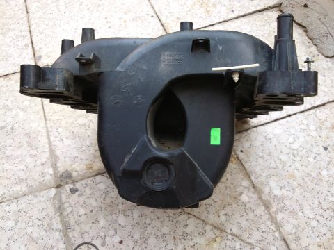 1998 Ford Crown Victoria - This black plastic intake manifold features a green sticker and a watermark for Supermotors.net.