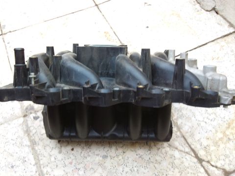 1998 Ford Crown Victoria - This is a plastic intake manifold with silver metal components.