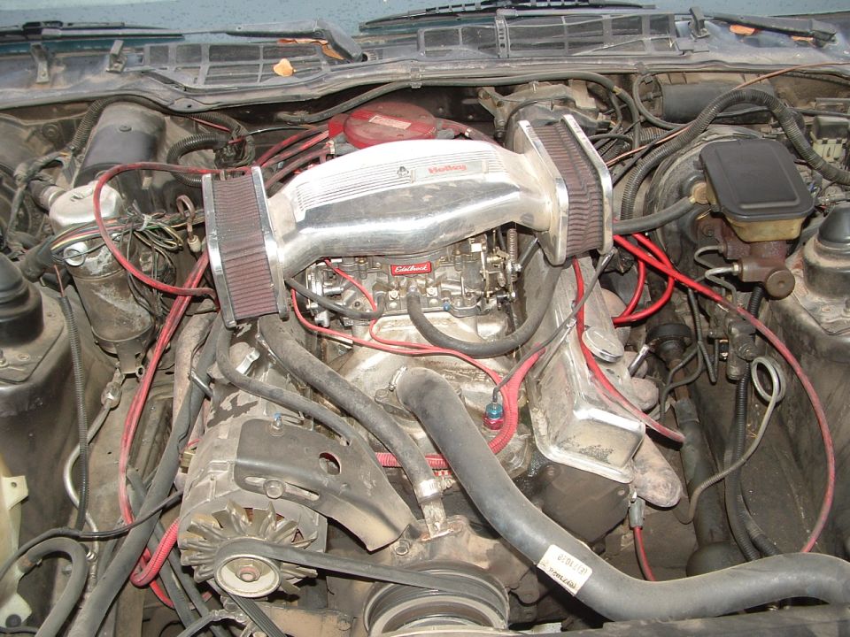 engine bay with Edelbrock carburetor and dual air filters