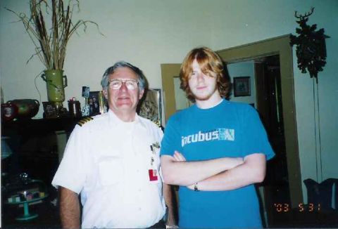 1996 Ford Taurus - Two men pose for a photo indoors, with a timestamp visible in the lower right corner.