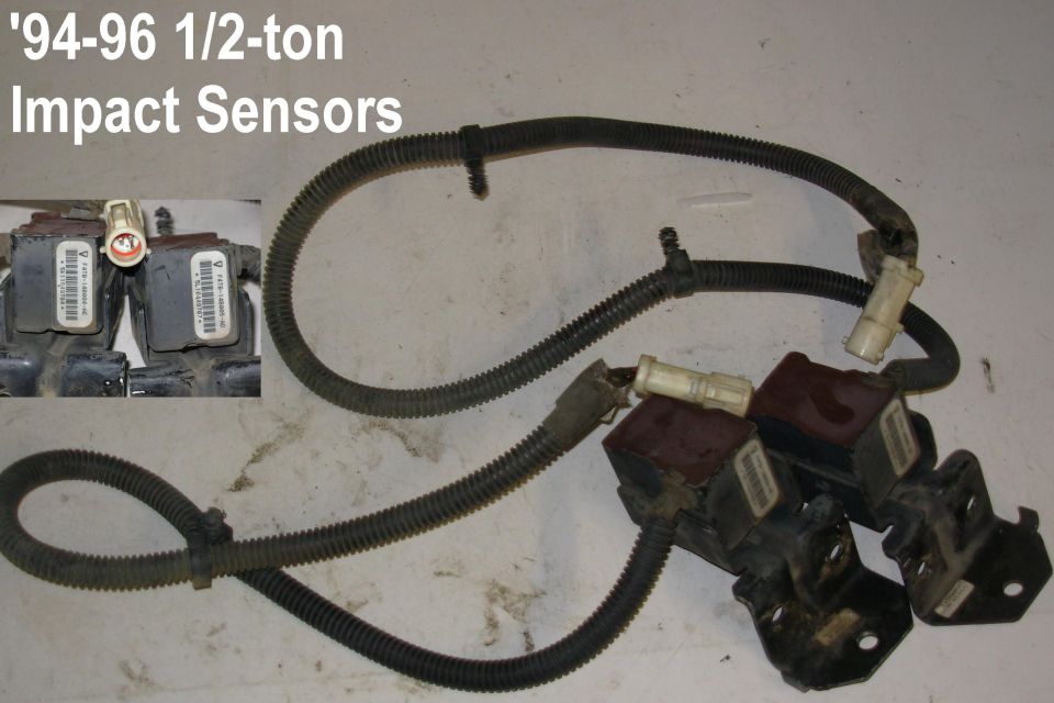 94-96 half-ton impact sensors with wiring harness on a white floor
