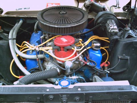1969 Ford Ranchero - Close-up view of a vehicle's engine bay, showing various components and wiring.