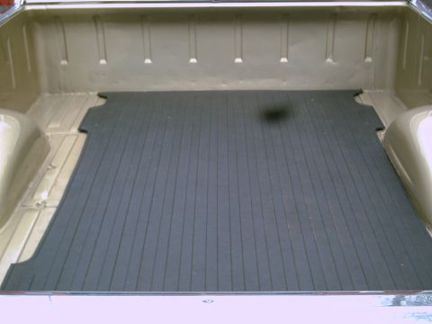 1969 Ford Ranchero - Interior view of the truck bed in a 1969 Ford Ranchero, fitted with a rubber mat.