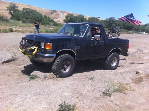 1990 Ford Bronco - This 1990 Ford Bronco is equipped for off-road use and flies an American flag.