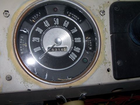 1973 Ford Bronco - The dashboard features a central speedometer and auxiliary gauges for fuel, temperature, and alternator output.