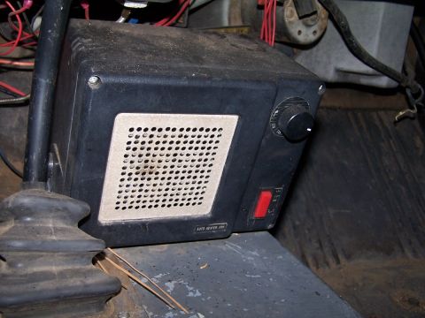 1973 Ford Bronco - An aftermarket auto heater fan unit is visible inside the vehicle's cabin.