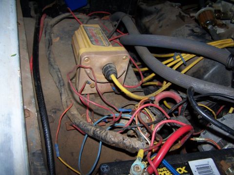 1973 Ford Bronco - Engine bay wiring and ignition coil detail, showing a complex network of electrical connections.