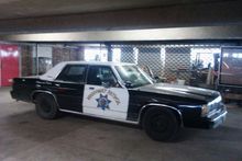 1991 Ford LTD Crown Victoria - This police car appears to be from the 1980s, not a 1991 model as claimed.
