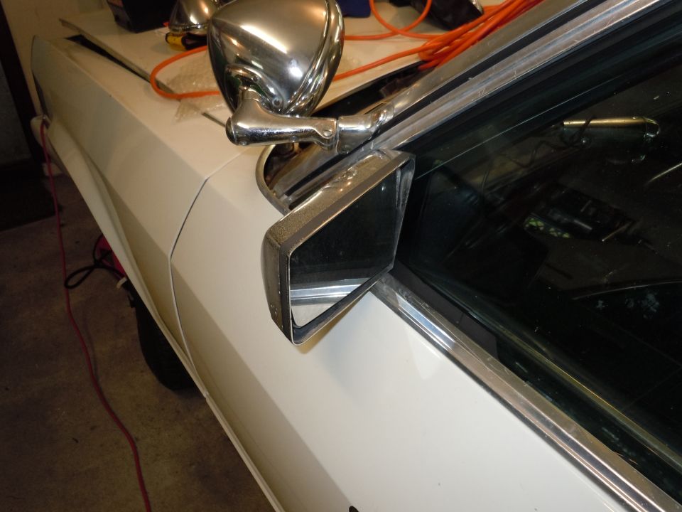 White car side mirror assembly with chrome trim