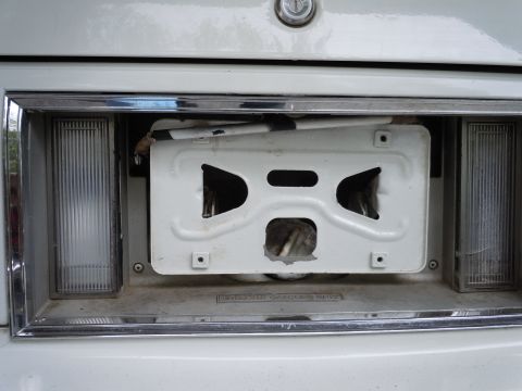 2001 Ford Crown Victoria - License plate bracket removed from the rear of a 2001 Ford Crown Victoria, exposing wiring.