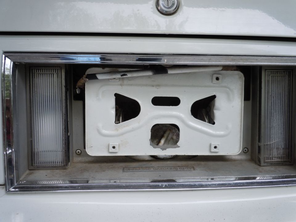 2001 Ford Crown Victoria rear bumper with license plate bracket removed, showing wiring