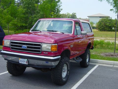 1979 Ford Bronco - This lifted red Ford Bronco features a distinctive body style from the late 1980s.