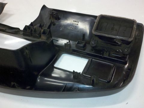 1979 Ford Bronco - A black plastic dashboard trim piece with visible part numbers is shown from an interior angle.