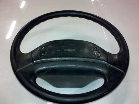 1979 Ford Bronco - This is a Ford steering wheel, likely from a car or truck, with integrated controls.