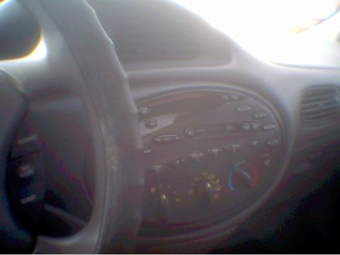 1997 Ford Taurus - Interior view of a 1997 Ford Taurus, showing the dashboard and steering wheel.