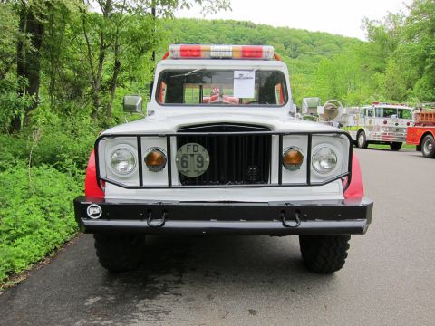 1991 Ford LTD Crown Victoria - Head-on view of a vintage fire brush truck with a black grille guard, dual headlights and a license plate reading FD 619.