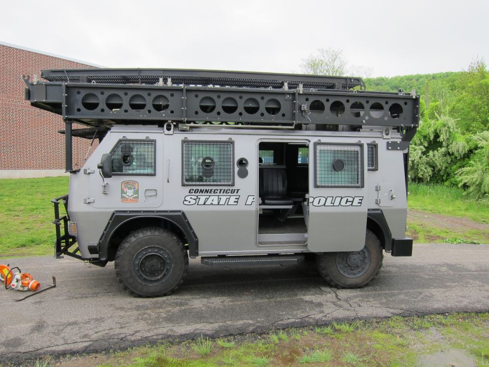 Gray Connecticut State Police armored 4x4 truck with side door open