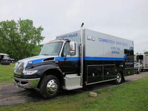 1991 Ford LTD Crown Victoria - Front three-quarter view of a black and silver International box truck marked Connecticut State Police State Fire Marshal Fire Investigatio…
