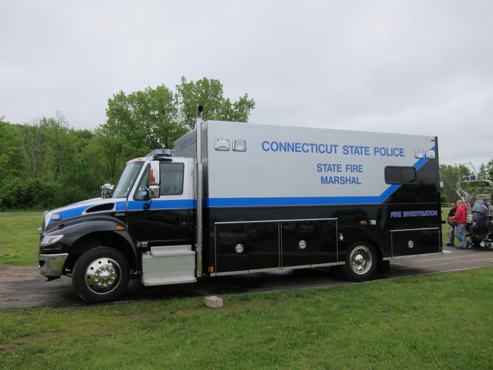 Side view of black and silver Connecticut State Police Fire Marshal box truck