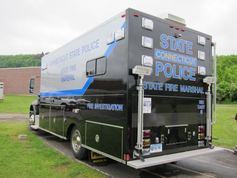 1991 Ford LTD Crown Victoria - Rear three-quarter view of a black Connecticut State Police State Fire Marshal box truck with floodlights and STATE POLICE lettering.