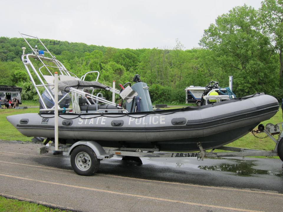 Gray State Police rigid inflatable boat on a single-axle trailer