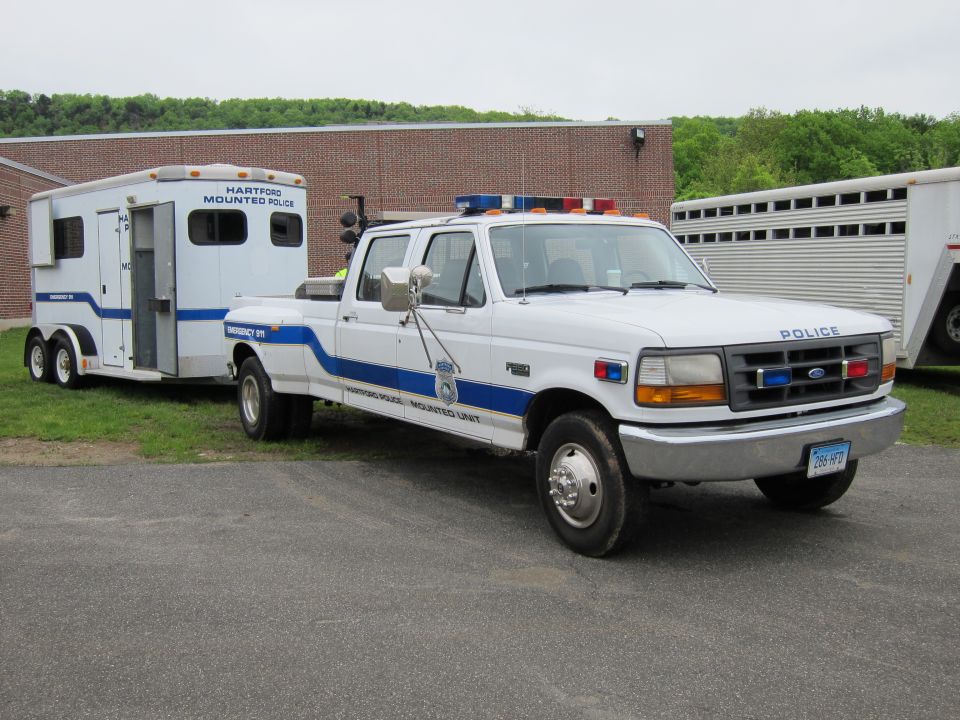 White Ford police pickup towing Hartford Mounted Police horse trailer