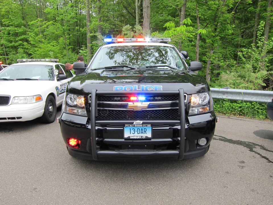 Front view of a black Chevrolet Tahoe police SUV with pushbar marked POLICE