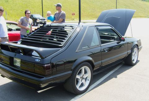 2007 Ford Mustang - This black Ford Mustang coupe, likely a 1987 model, is displayed with its hood open and rear window louvers.